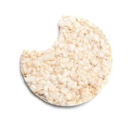 Crunchy rice cake with bite mark on white background, top view