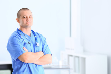 Portrait of medical assistant with stethoscope in hospital. Space for text