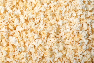 Foto op Plexiglas Fresh tasty popcorn as background, top view © New Africa