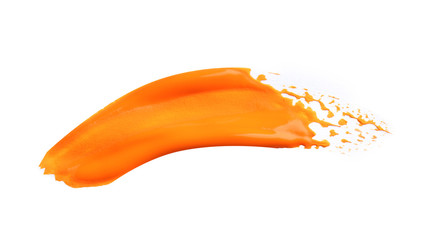 Abstract brushstroke of orange paint isolated on white