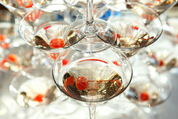 Glasses of champagne with cherries