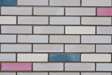Brick wall with colored bricks. City backgrounds.