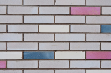 Brick wall with colored bricks. City backgrounds.