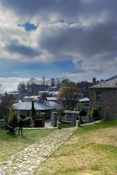 The church and stone-built houses of the traditional village of Nymphaio in Macedonia in Greece