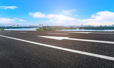 Empty asphalt road square and natural landscape under the blue sky