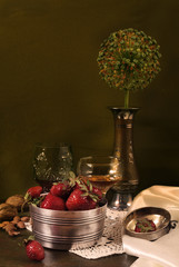 Still life with strawberries and a glass