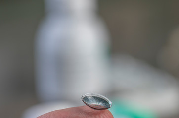 Contact lens bended in wrong direction on finger isolated