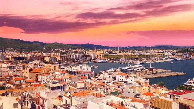 Cinemagraph - Clouds floating over the port of the Town of Ibiza on Ibiza Island. Sunset on Ibiza