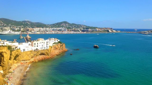 Cinemagraph - Boats floating near the port of the Town of Ibiza on Ibiza Island. Light waves in the harbor on sunny summer day