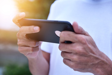 People wearing white shirts are using mobile phones. For communication and online product trading