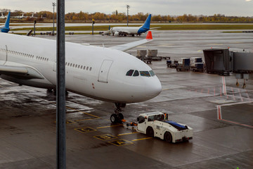 Plane on the runway with a aircraft maintenance.