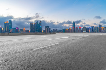 Empty asphalt road along modern commercial buildings in China,s cities