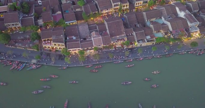 Aerial view of Hoi An old town or Hoian ancient town in night. Royalty high-quality free stock video footage top view of Hoai river and boat traffic Hoi An. Hoi An street and river in night with light