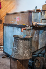 Maple syrup bucket waiting for draw off