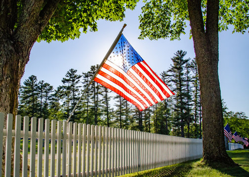 American Flag at cemetery fence