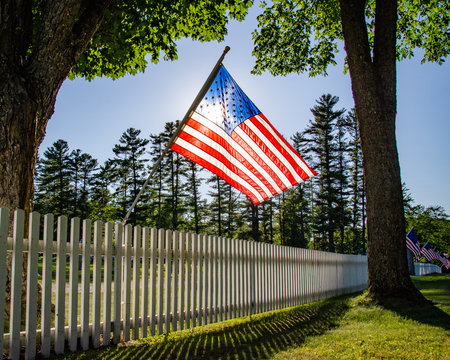 American Flag at cemetery fence