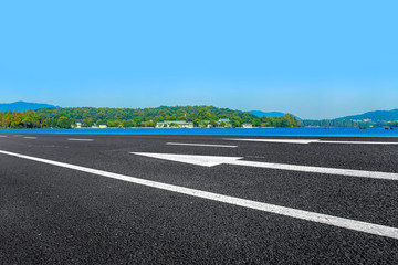 Empty asphalt road and natural landscape under the blue sky