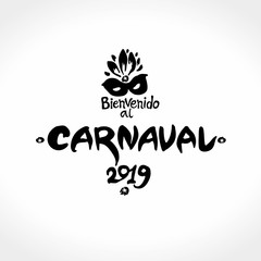 Bienvenido al Carnaval. 2019. Beautiful logo in spanish. Translated as Welcome to Carnival. Vector handwritten logo with mask. Painted mask and inscription imitation of painting with brush and ink.
