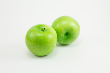 Green apples on white background
