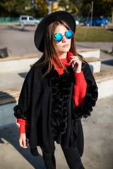 Fototapeta premium Young woman outdoors walking in hat