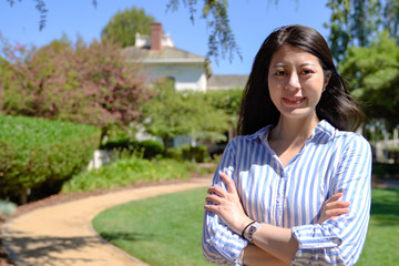 asian businesswoman standing in spring garden