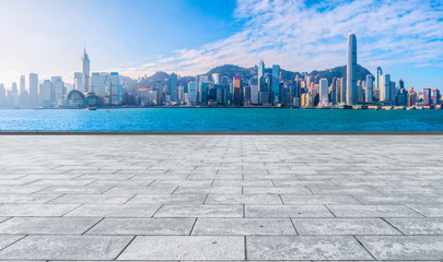 Empty marble floors and city views under the blue sky