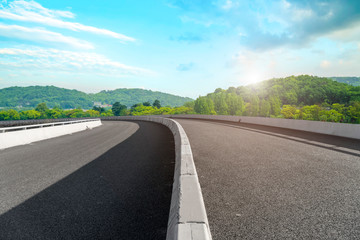 Empty asphalt road square and natural landscape under the blue sky