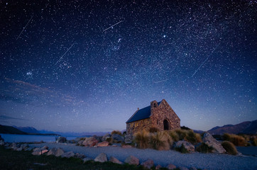 Night sky over Good Shepherd's Chapel, Lake Tekapo, New Zealand - obrazy, fototapety, plakaty