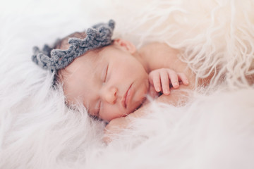 the child's face with a headband in the form of a crown