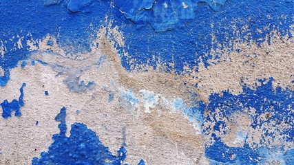 The background of the cement wall in which the old blue color is stained is stained.