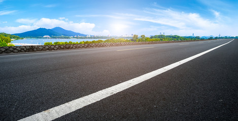 Empty asphalt road square and natural landscape under the blue sky