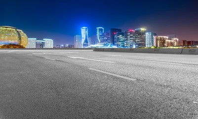 Road Pavement and Night View of Hangzhou Urban Architecture..