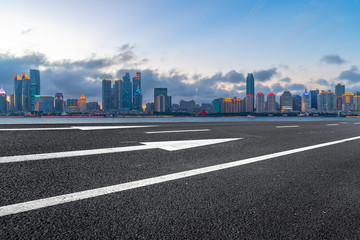 Empty asphalt road along modern commercial buildings in China,s cities