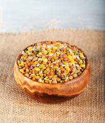 Fototapeta na wymiar Colorful various beans or lentils and whole grain seeds or cereal in bowl