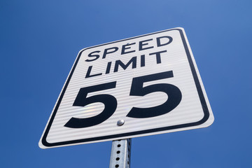 The fifty-five miles per hour street sign in the California sun.