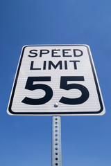 The fifty-five miles per hour street sign in the California sun.