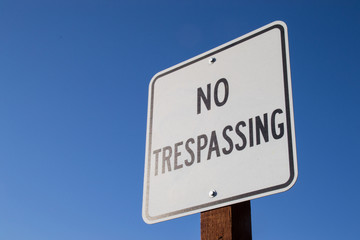 The "No Trespassing" sign in the California sun.