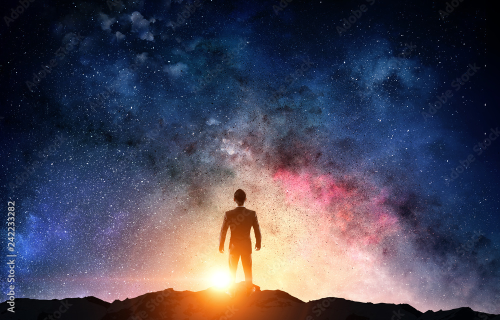 Wall mural businessman and cosmos concept