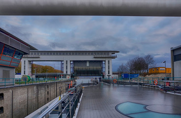 Passenger boat passing through canal locks near Amsterdam, Holland