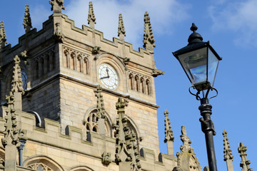 Fototapeta na wymiar Wigan Parish Church clock tower in Lancashire, England.
