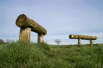 The wooden bench as the sun sets in the English countryside.