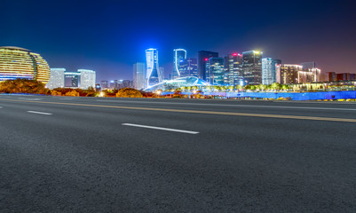 Road Pavement and Night View of Hangzhou Urban Architecture..