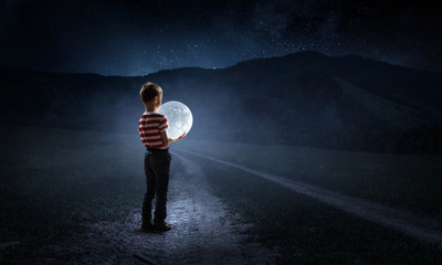 Boy holds the moon . Mixed media