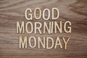 Fototapeta premium Good Morning Monday text message on wooden background