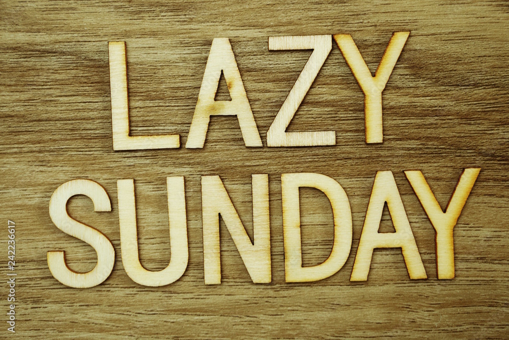 Aufkleber lazy sunday text message on wooden background