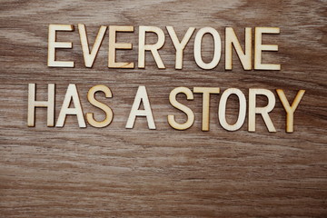 every on has a story text message on wooden background