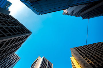 Obraz na płótnie Canvas Bottom up view of Hong Kong Commercial buildings