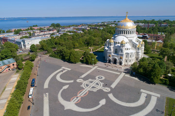 Fototapeta na wymiar View of Anchor Square and Nikolsky Naval Cathedral on a sunny June day (shot from a quadrocopter). Kronstadt, St. Petersburg