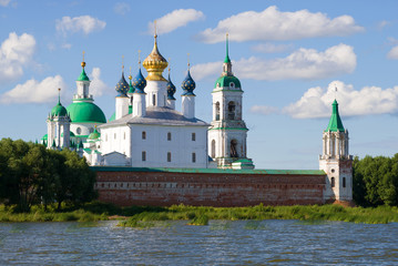 Fototapeta na wymiar Domes of the Spaso-Yakovlevsky Dmitrovsky Monastery on a sunny July day. Rostov the Great, Golden Ring of Russia