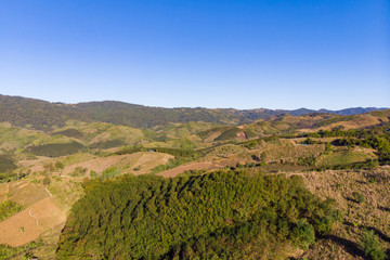 Drone shot aerial view landscape of mountain and nature against blue sky